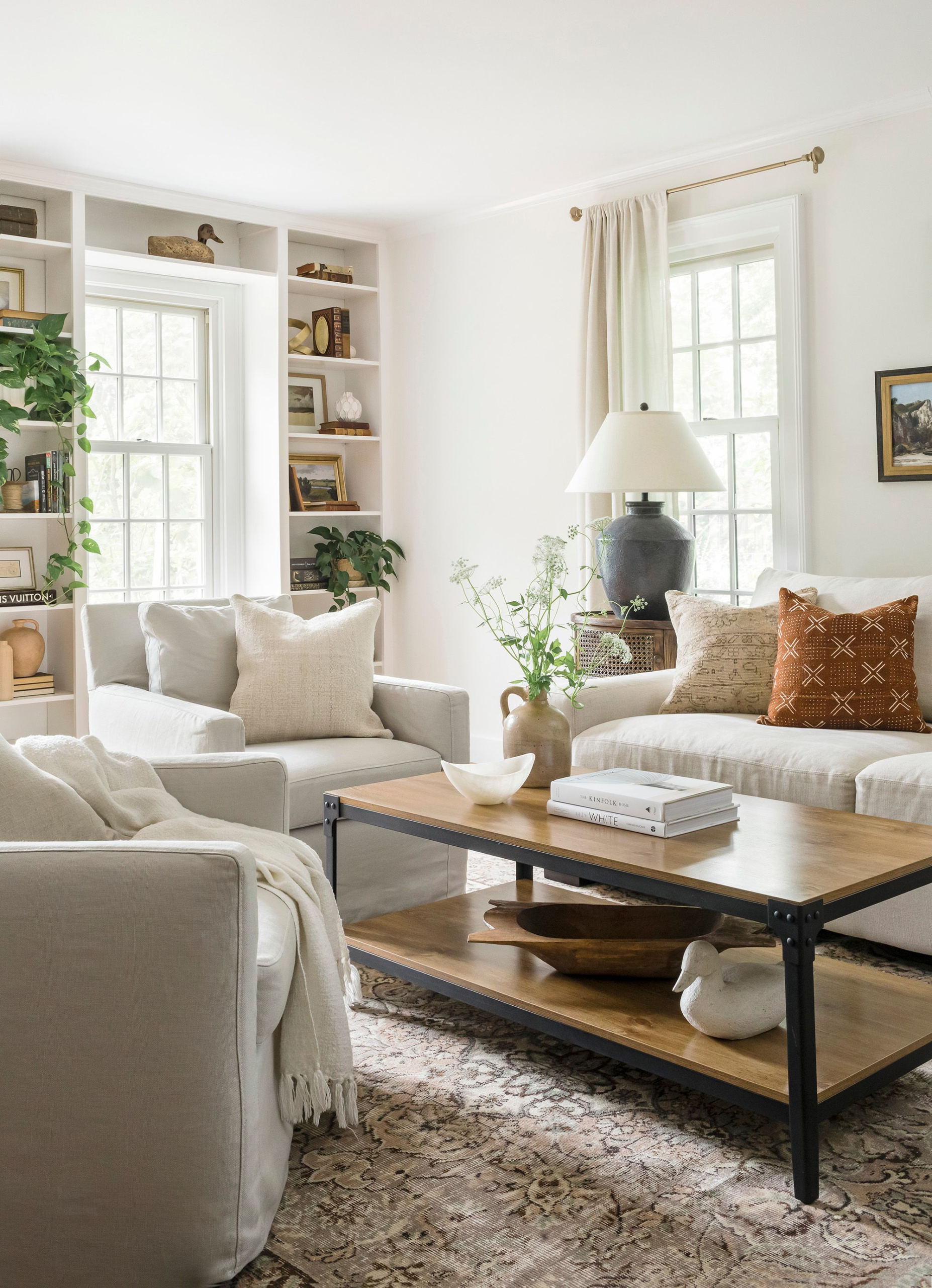Spring organic modern styling vignette with warm neutrals, soft textures, and natural materials